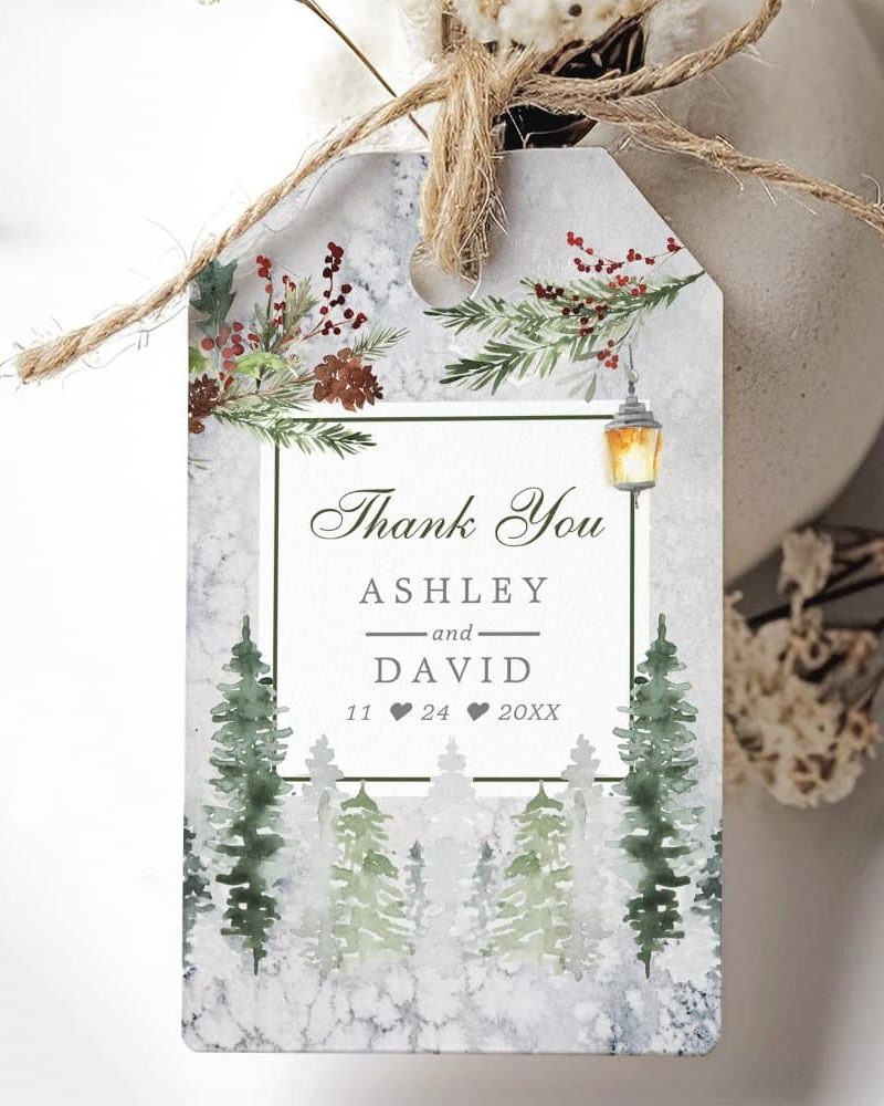 Wedding thank you tag with winter forest scene, lantern, and Ashley & David's names and wedding date.
