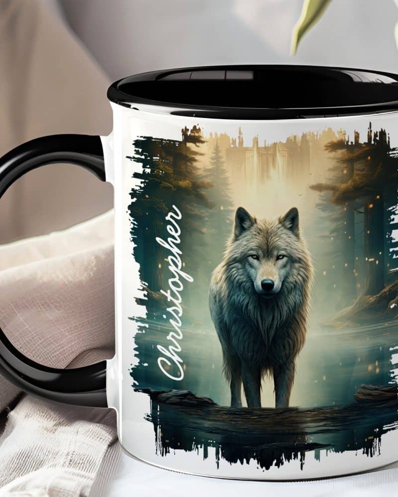 A black-handled mug with a wolf illustration. The wolf stands in a misty forest by water. The name Christopher is written on the mug.