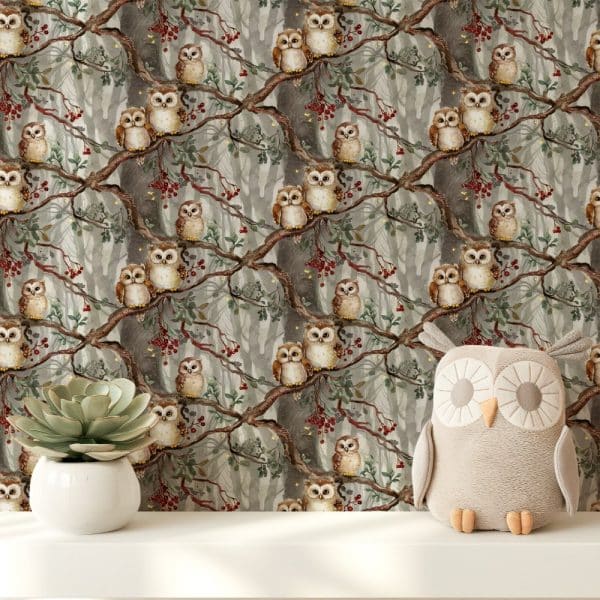 A Plush Owl Sits In Front Of Wallpaper Depicting Many Owls Perched On Branches In A Misty Forest.