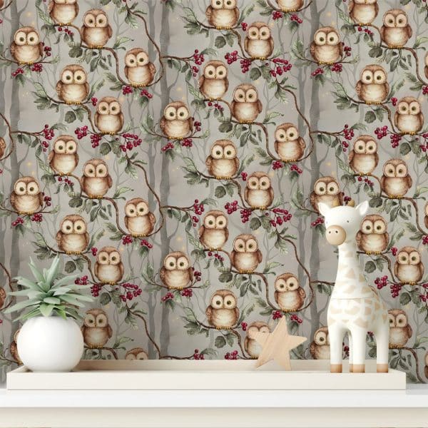 A Gray Owl-Themed Wallpaper Featuring Numerous Owls Perched On Branches With Red Berries, Displayed On A Shelf With A Small Potted Plant And A Giraffe Toy.
