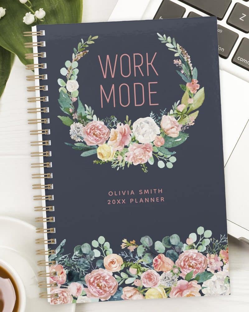 Dark blue planner with a floral wreath design and the words Work Mode.