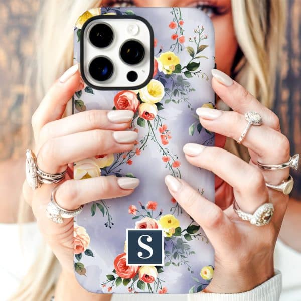 Hands Holding A Lavender Floral Iphone Case With A Navy Blue Initial S.