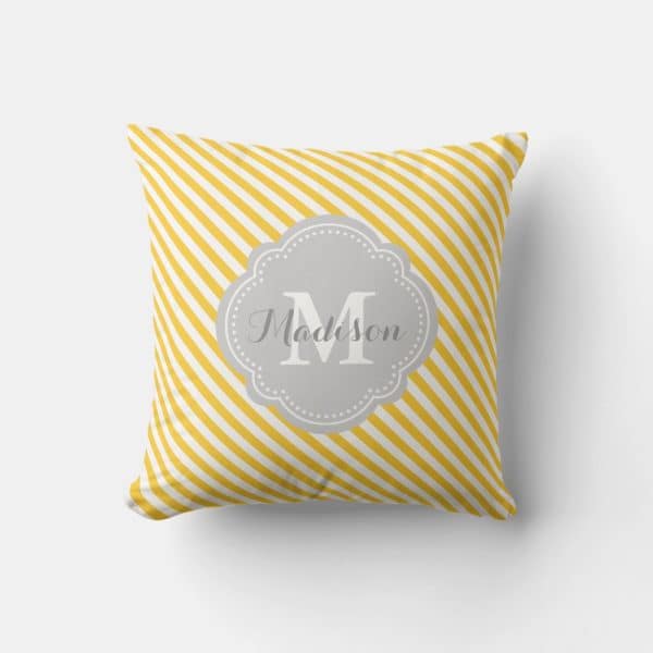 Yellow And White Striped Pillow With A Gray Monogram Featuring The Initial M And The Name Madison.