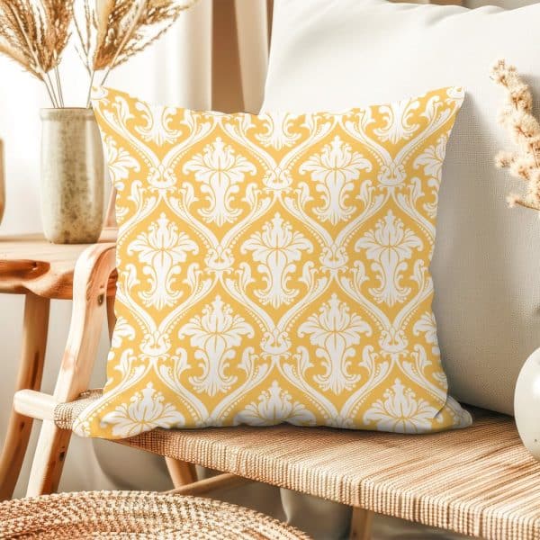 Mustard Yellow Throw Pillow With A White Damask Pattern.