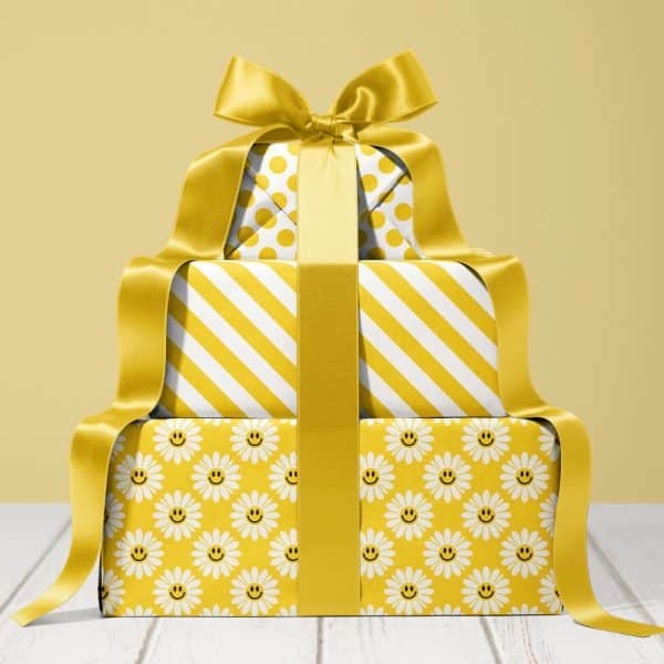 Stack Of Three Yellow And White Gifts With A Large Yellow Bow.