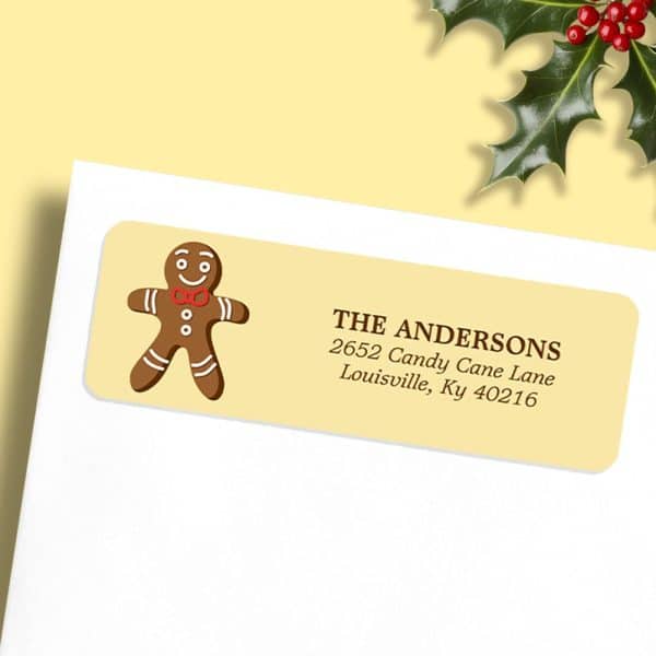 A Pale Yellow Return Address Label With A Gingerbread Man And The Andersons' Address.