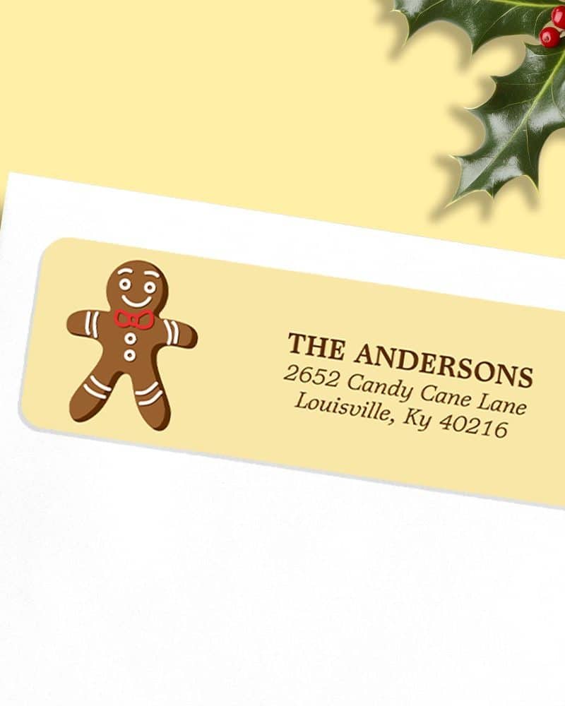 A pale yellow return address label with a gingerbread man and the Andersons' address.