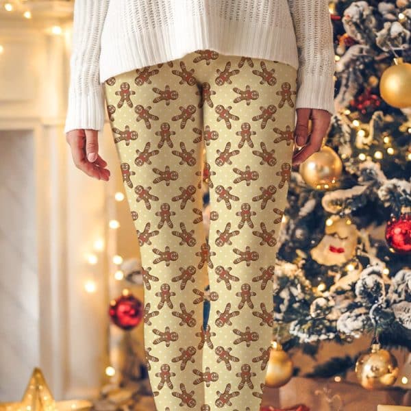Beige Leggings With A Repeating Pattern Of Gingerbread Men.