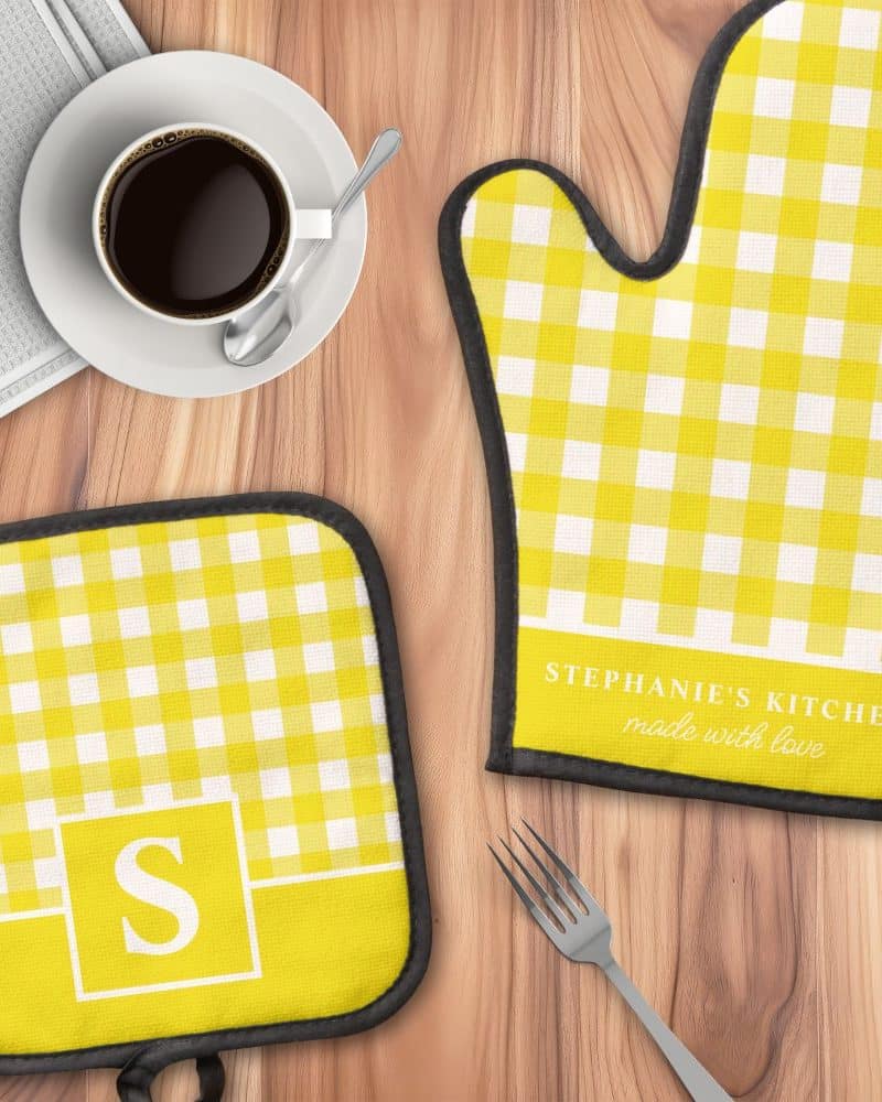 Yellow gingham oven mitt and pot holder set, personalized with a name and initial.