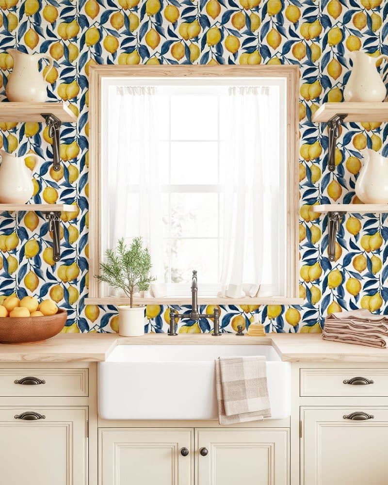 Kitchen backsplash with a lemon pattern wallpaper.