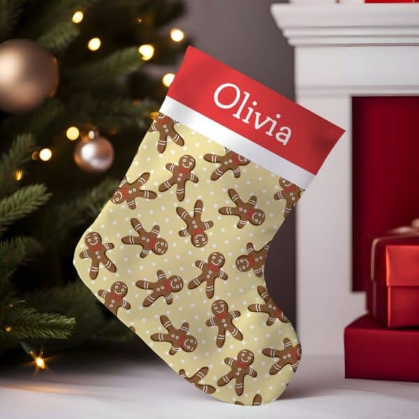 Personalized Christmas Stocking With A Cream Background And Repeating Gingerbread Man Pattern, The Name Olivia Is On The Cuff.