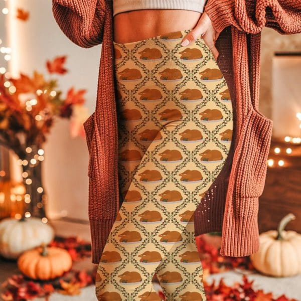 Person Wearing Thanksgiving Themed Leggings Featuring A Repeating Pattern Of Roasted Turkeys On A Tan Background.