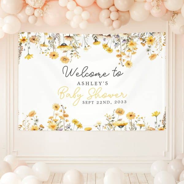 A Baby Shower Banner With Yellow Wildflowers And Text That Says Welcome To Ashley'S Baby Shower, September 22Nd, 2033.