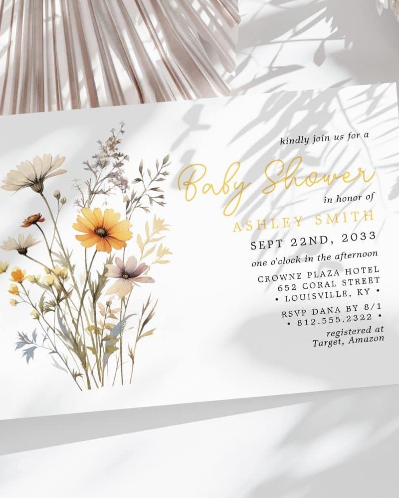 Baby shower invitation with watercolor wildflowers in yellow and white.