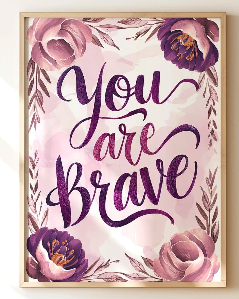 Framed art print with purple floral border and the text You Are Brave in a stylized script font.