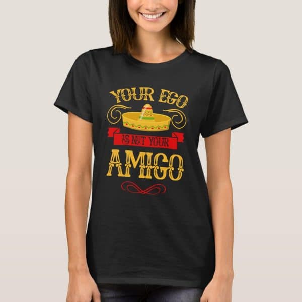 Woman Wearing A Black T-Shirt With A Sombrero Graphic And Text That Reads Your Ego Is Not Your Amigo.