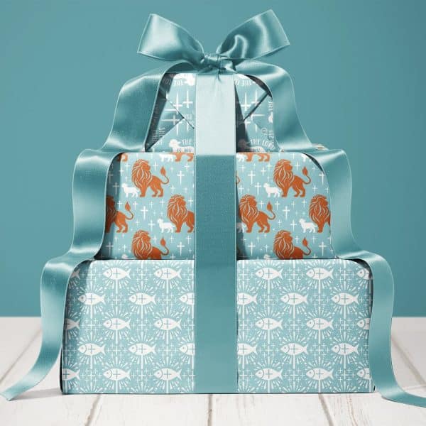 Stack Of Gifts Wrapped In Teal Paper Featuring Religious Symbols, Tied With A Large Teal Ribbon.