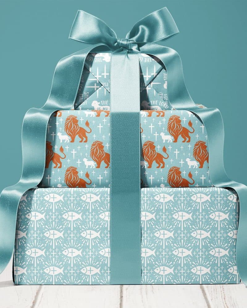 Stack Of Gifts Wrapped In Teal Paper Featuring Religious Symbols, Tied With A Large Teal Ribbon.